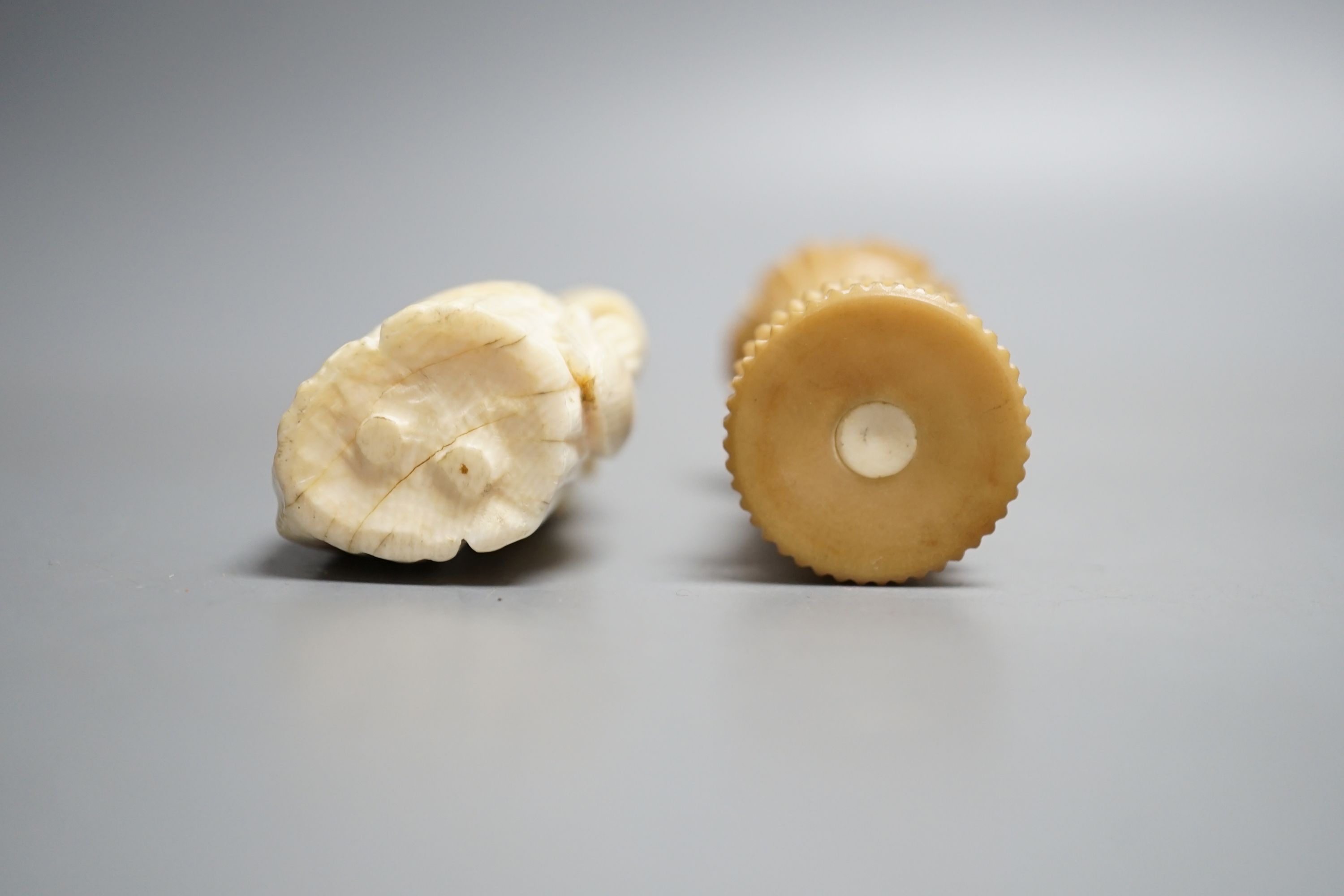 A Dieppe ivory figural needle case, vegetable ivory sewing tape and pin cushion, 19th century